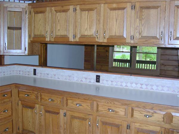 64 Bethany Road Framingham, MA 01702 - Photo 9 of 30 a kitchen with granite countertop a sink and a white cabinets