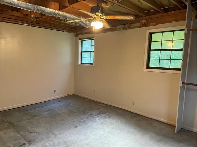 a view of empty room with windows