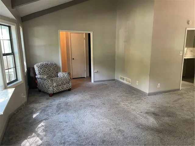 a view of livingroom with furniture and window