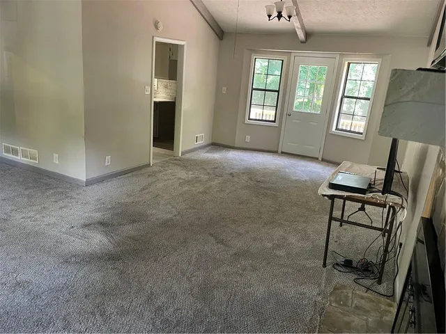 a view of livingroom with furniture and windows