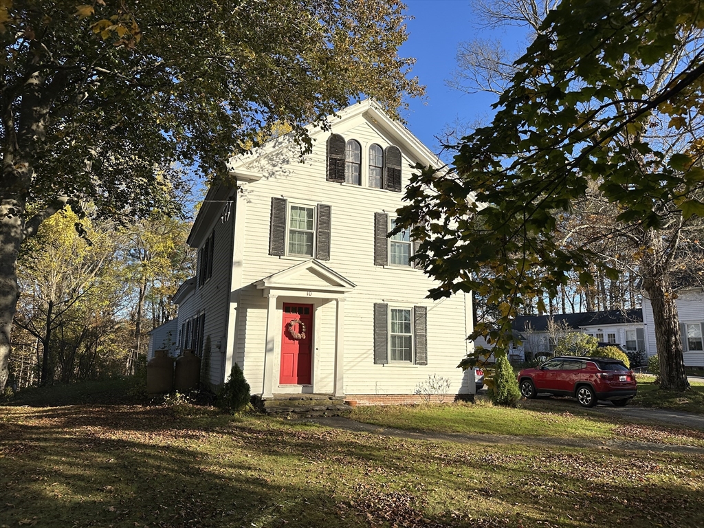 10 Maple Street Sturbridge, MA 01566 - Photo 22 of 30 a front view of a house with a yard