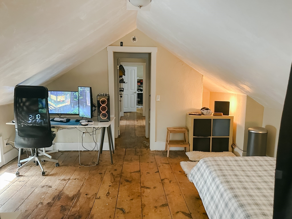 10 Maple Street Sturbridge, MA 01566 - Photo 28 of 30 a room with a bed and a television in it