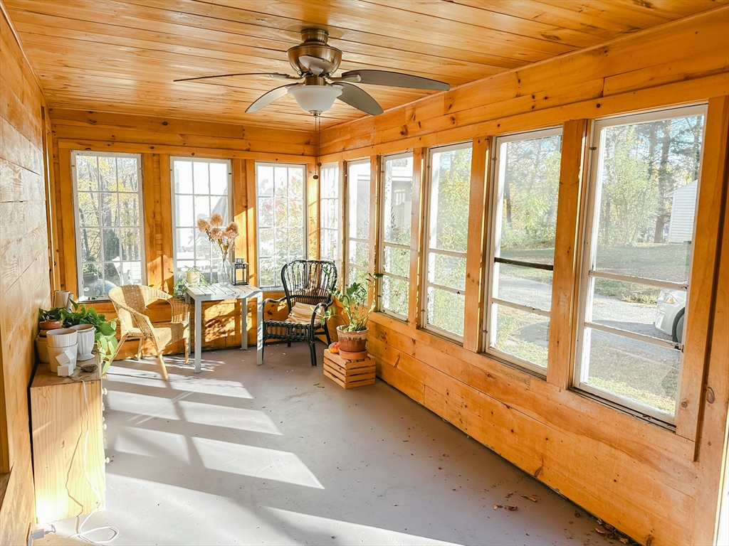 10 Maple Street Sturbridge, MA 01566 - Photo 4 of 30 a living room with furniture and floor to ceiling windows