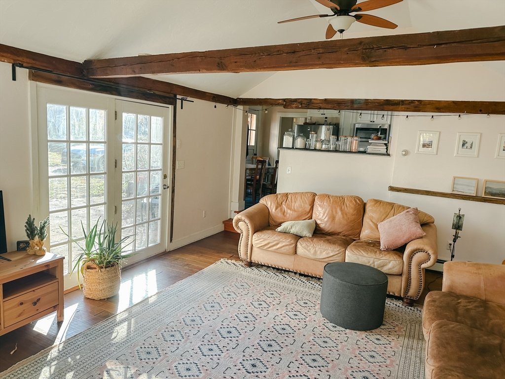 10 Maple Street Sturbridge, MA 01566 - Photo 8 of 30 a living room with furniture and painting on the wall