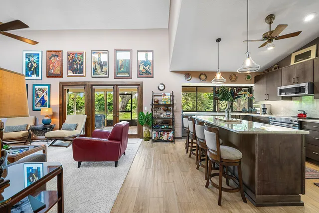a kitchen with a large window sink and cabinets
