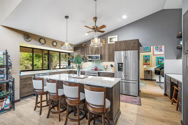 a kitchen with a large window and a sink