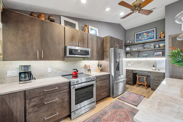 a living room with furniture or couch and a chandelier