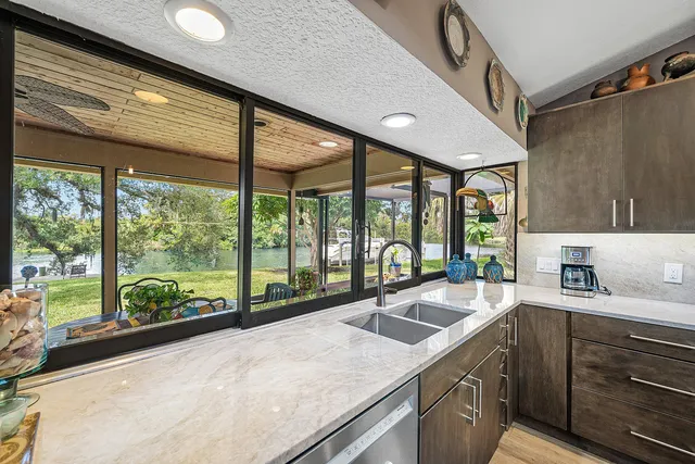a bedroom with a bed and glass window