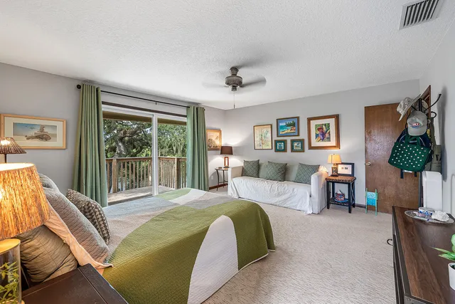 a livingroom with workspace and a window