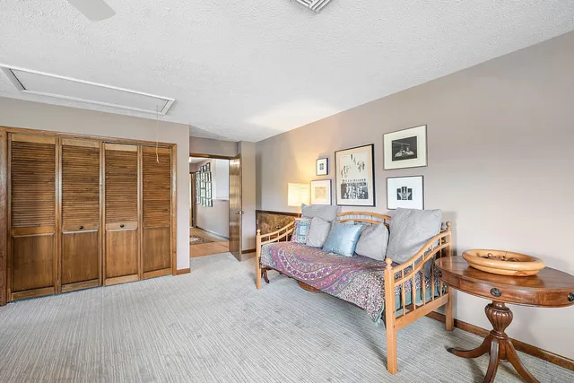 a view of a backyard with sitting area