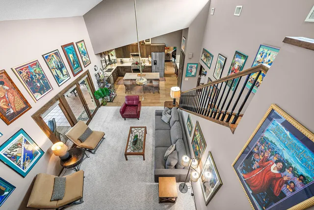 a aerial view of a house with a yard and garden