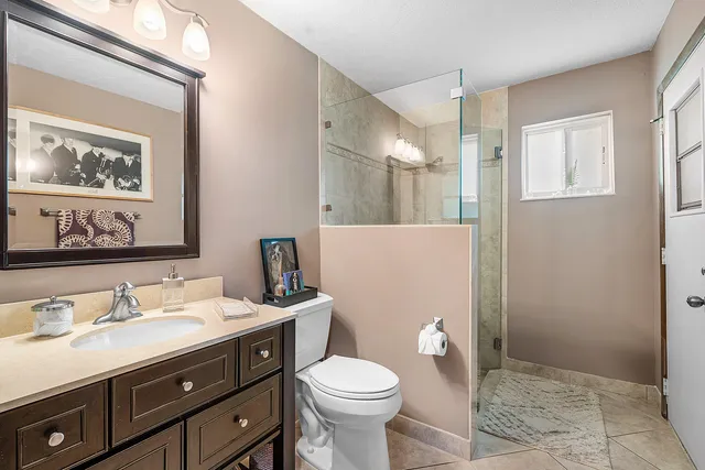 an aerial view of a house with a garden and swimming pool