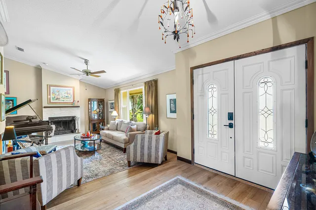 a living room with furniture a fireplace and a table