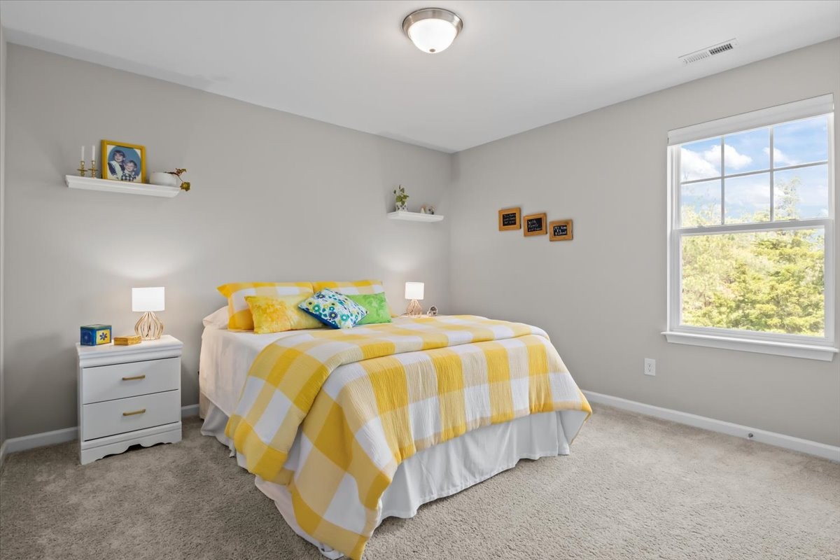 10011 Wendy Way Lyles, TN 37098 - Photo 27 of 51 a bedroom with a bed and window
