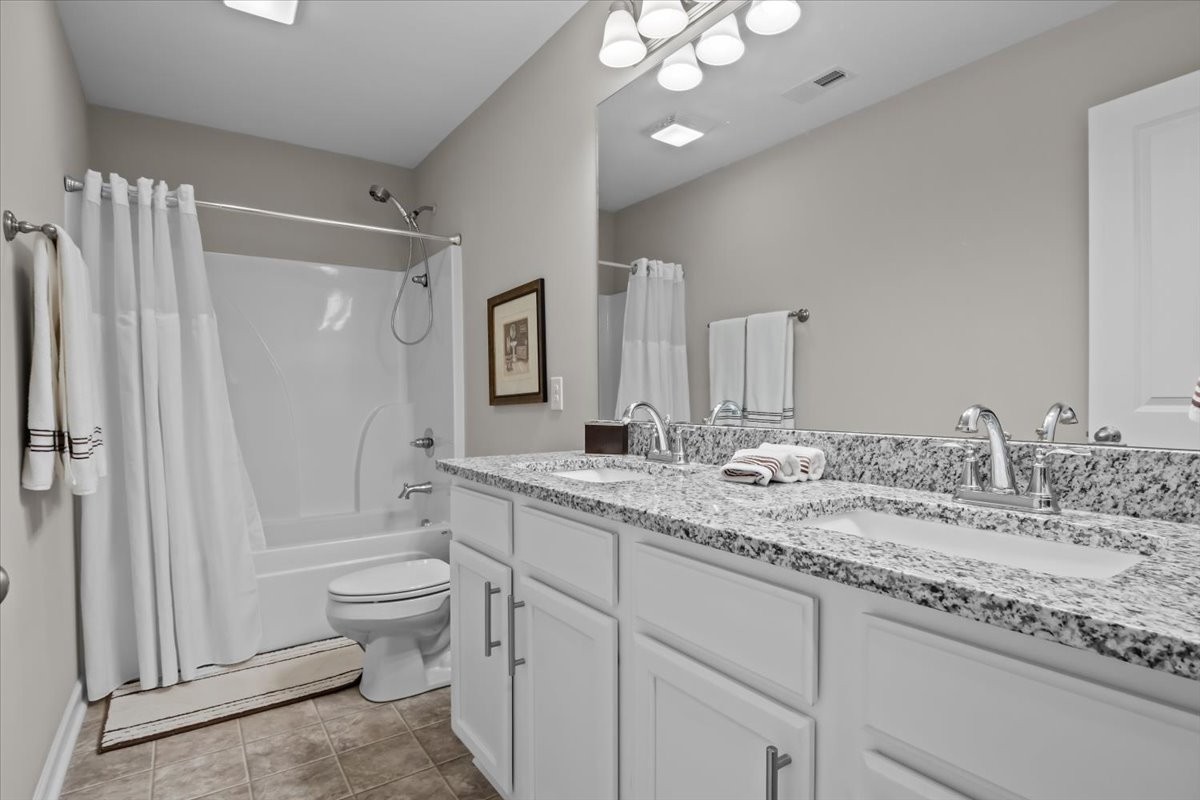 10011 Wendy Way Lyles, TN 37098 - Photo 32 of 51 a bathroom with a granite countertop sink toilet and shower