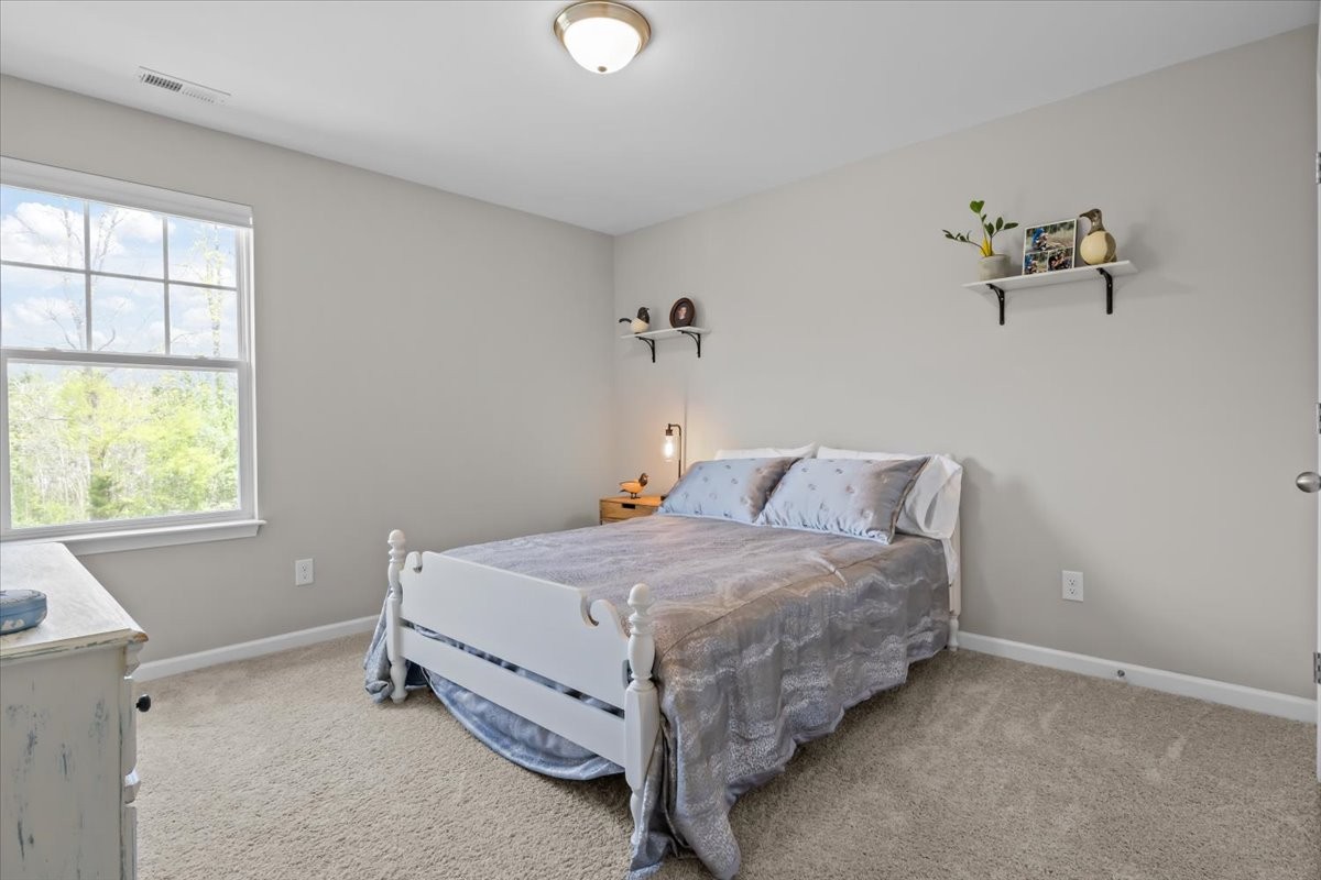 10011 Wendy Way Lyles, TN 37098 - Photo 33 of 51 a bedroom with a bed and a window