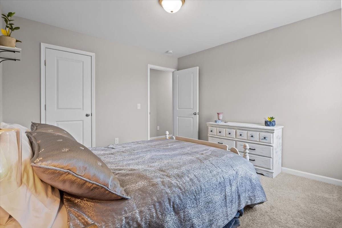 10011 Wendy Way Lyles, TN 37098 - Photo 34 of 51 a bedroom with a bed and a cabinets