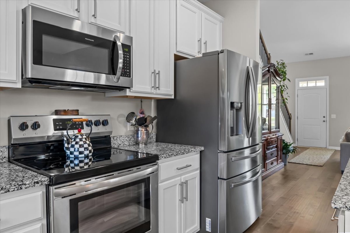 10011 Wendy Way Lyles, TN 37098 - Photo 10 of 51 a kitchen with stainless steel appliances granite countertop a refrigerator stove and microwave