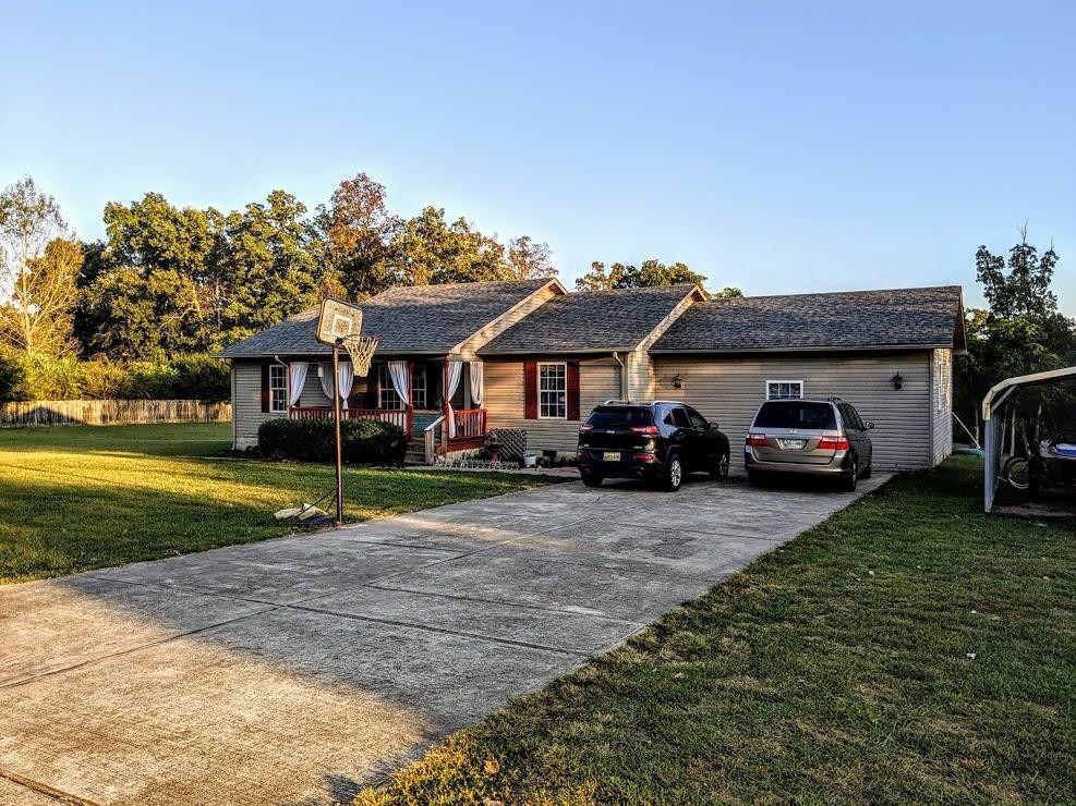 1556 Bicknell Road Clarkrange, TN 38553 - Photo 1 of 40 a front view of a house with garden