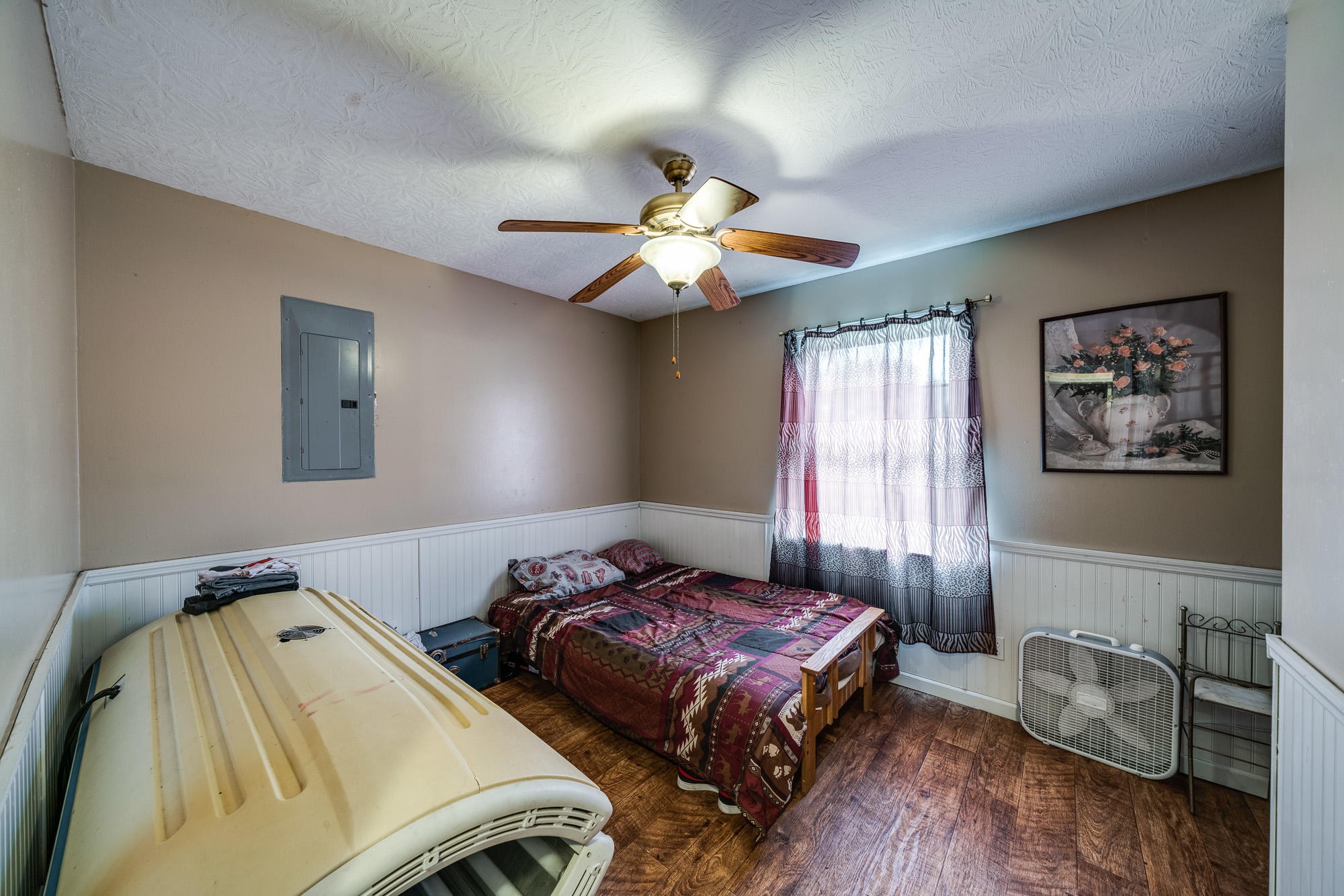 1556 Bicknell Road Clarkrange, TN 38553 - Photo 13 of 40 a bedroom with bed and a chandelier