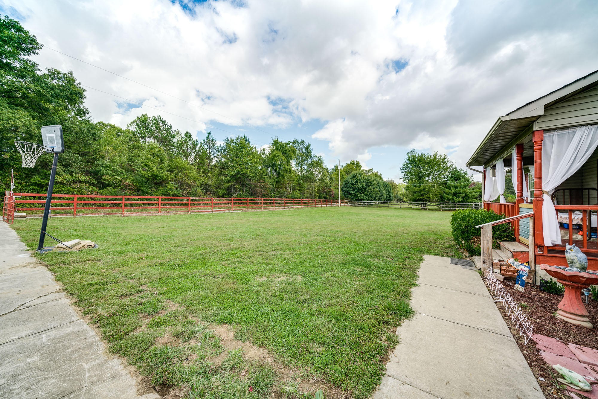 1556 Bicknell Road Clarkrange, TN 38553 - Photo 21 of 40 a backyard of a house with lots of green space table and chairs