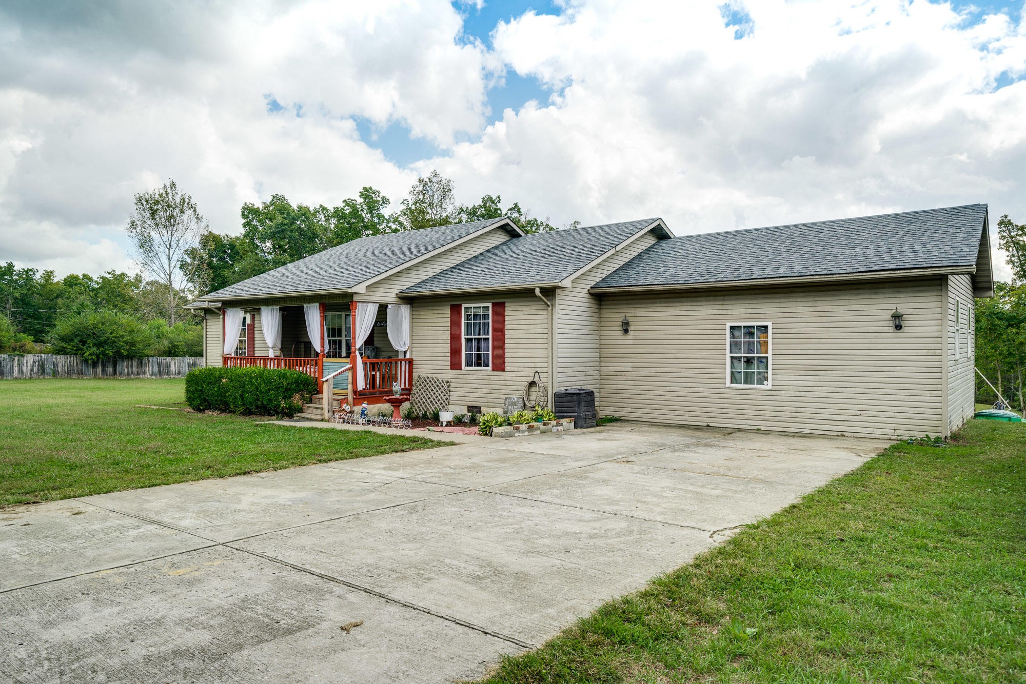 1556 Bicknell Road Clarkrange, TN 38553 - Photo 23 of 40 a front view of a house with a yard and garage