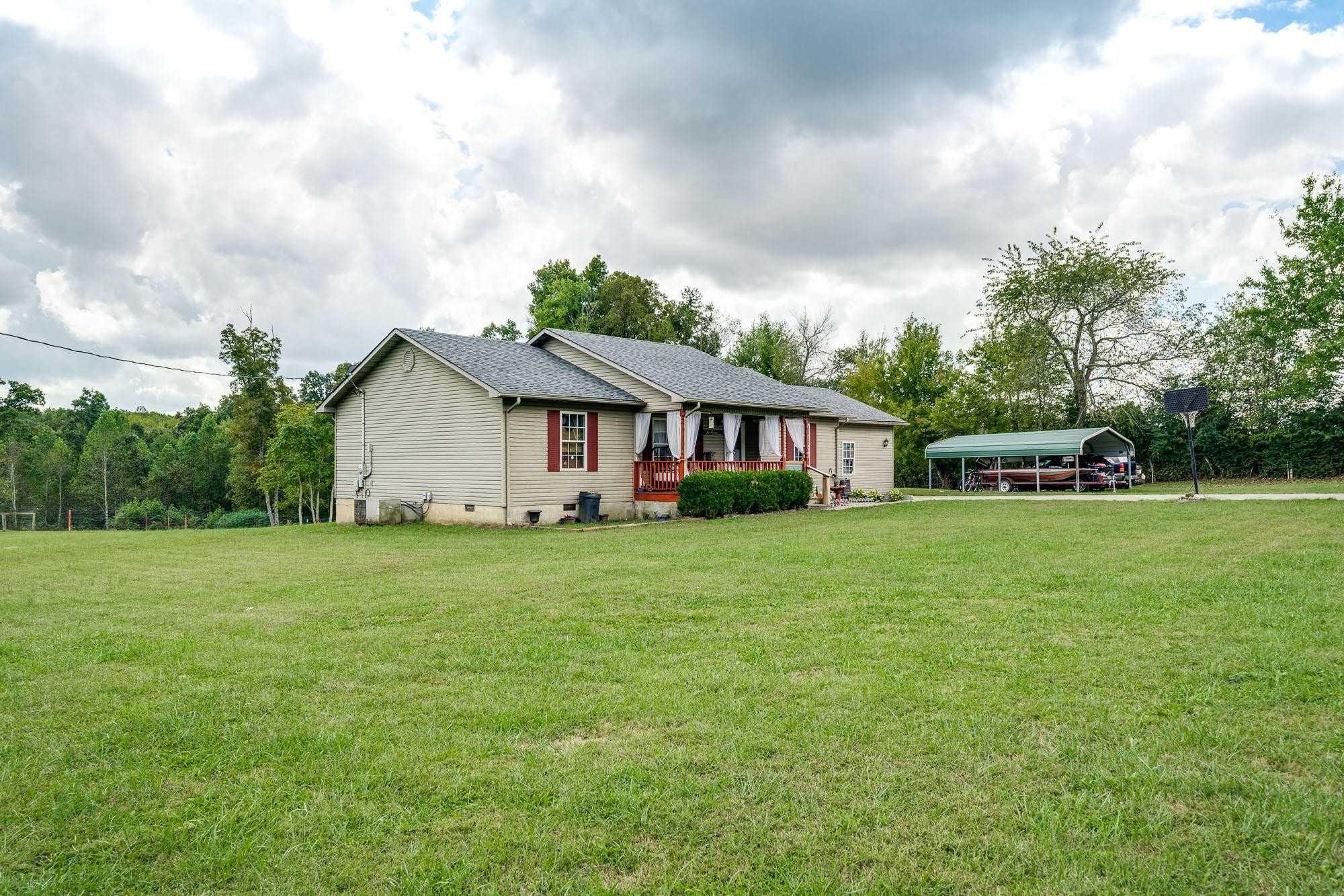 1556 Bicknell Road Clarkrange, TN 38553 - Photo 26 of 40 a front view of a house with garden