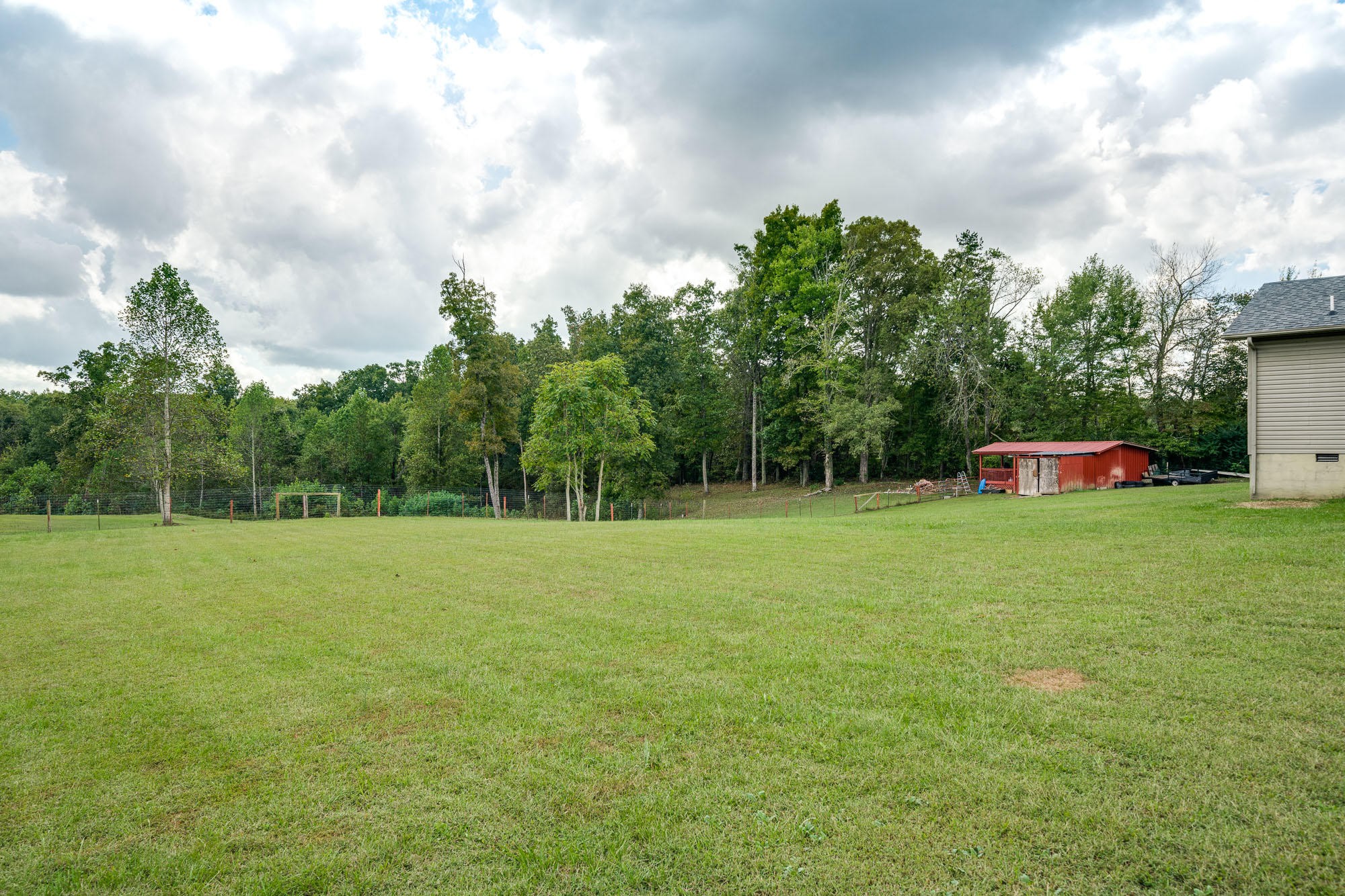 1556 Bicknell Road Clarkrange, TN 38553 - Photo 27 of 40 a car parked in the middle of a field