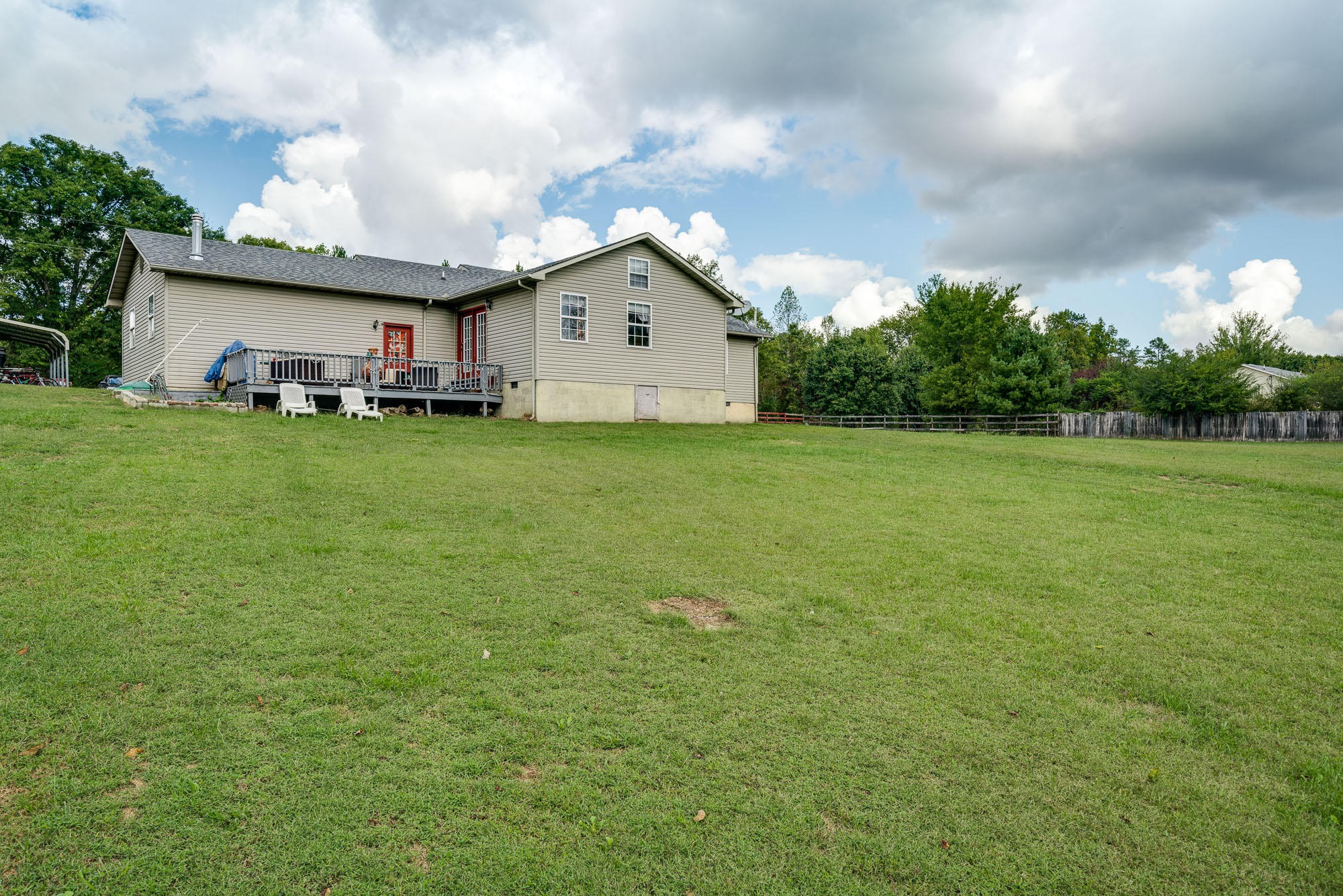1556 Bicknell Road Clarkrange, TN 38553 - Photo 29 of 40 a view of a backyard with plants and large trees