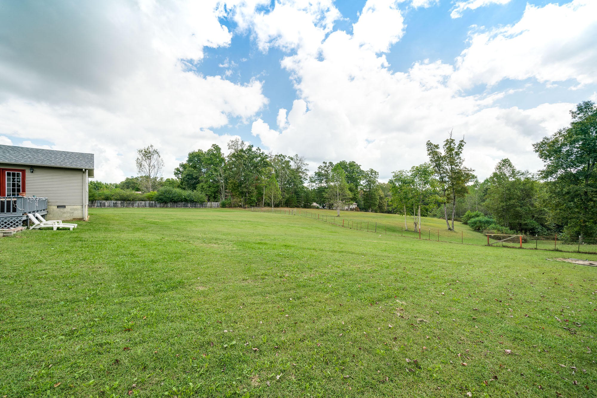 1556 Bicknell Road Clarkrange, TN 38553 - Photo 32 of 40 a view of a green field with wooden fence