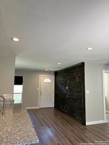 a view of an empty room and window