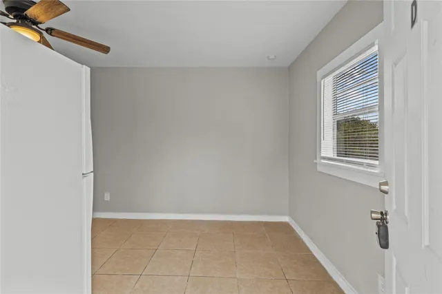 a view of an empty room with windows