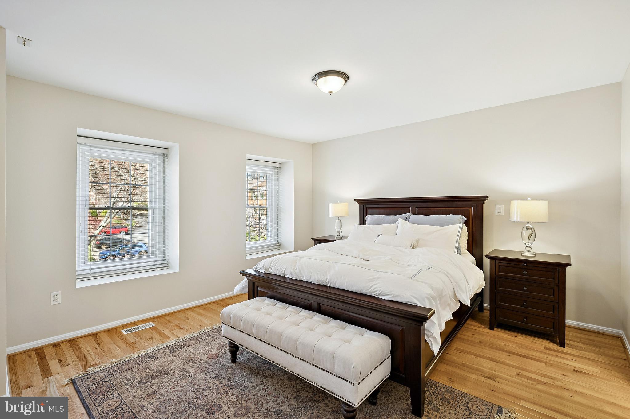 7810 Ashley Glen Road Annandale, VA 22003 - Photo 12 of 33 a bedroom with a bed lamp and a dresser