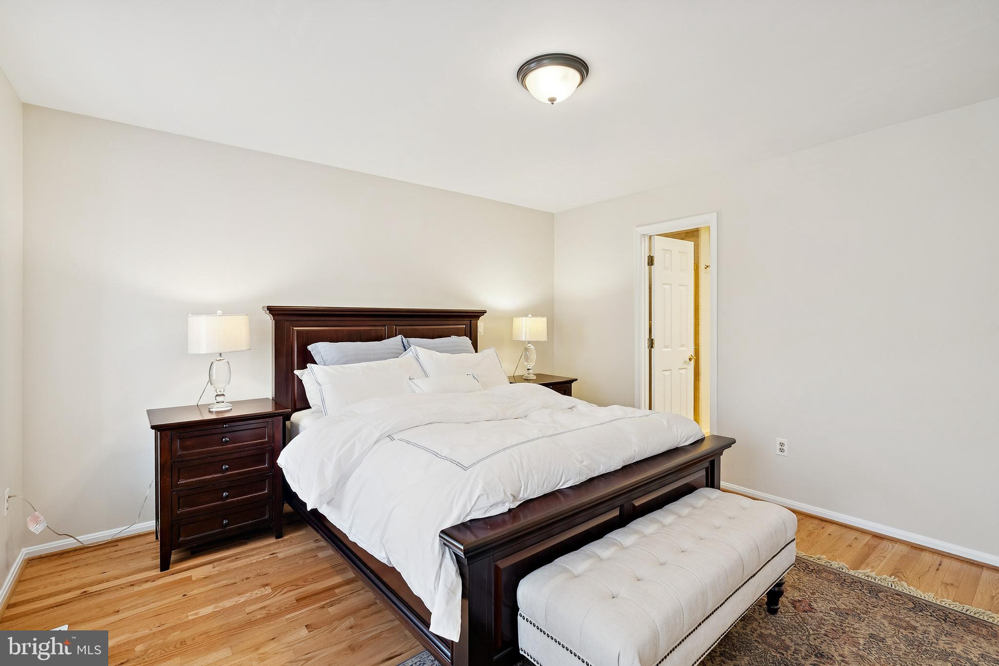 7810 Ashley Glen Road Annandale, VA 22003 - Photo 13 of 33 a bedroom with a bed and a night stand