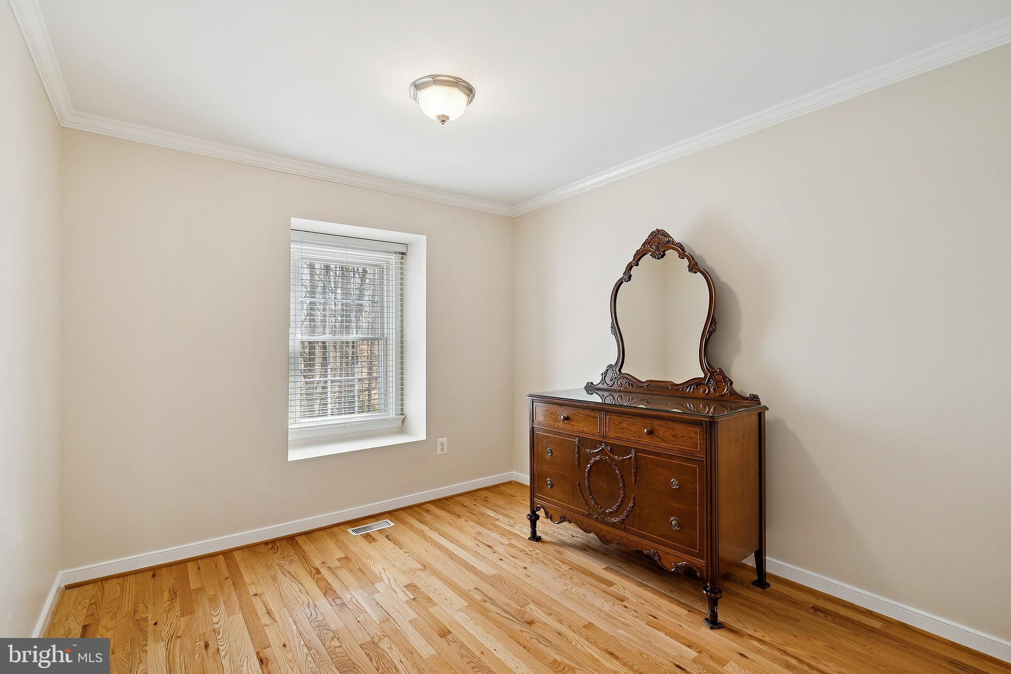 7810 Ashley Glen Road Annandale, VA 22003 - Photo 20 of 33 a view of a livingroom with wooden floor and a window