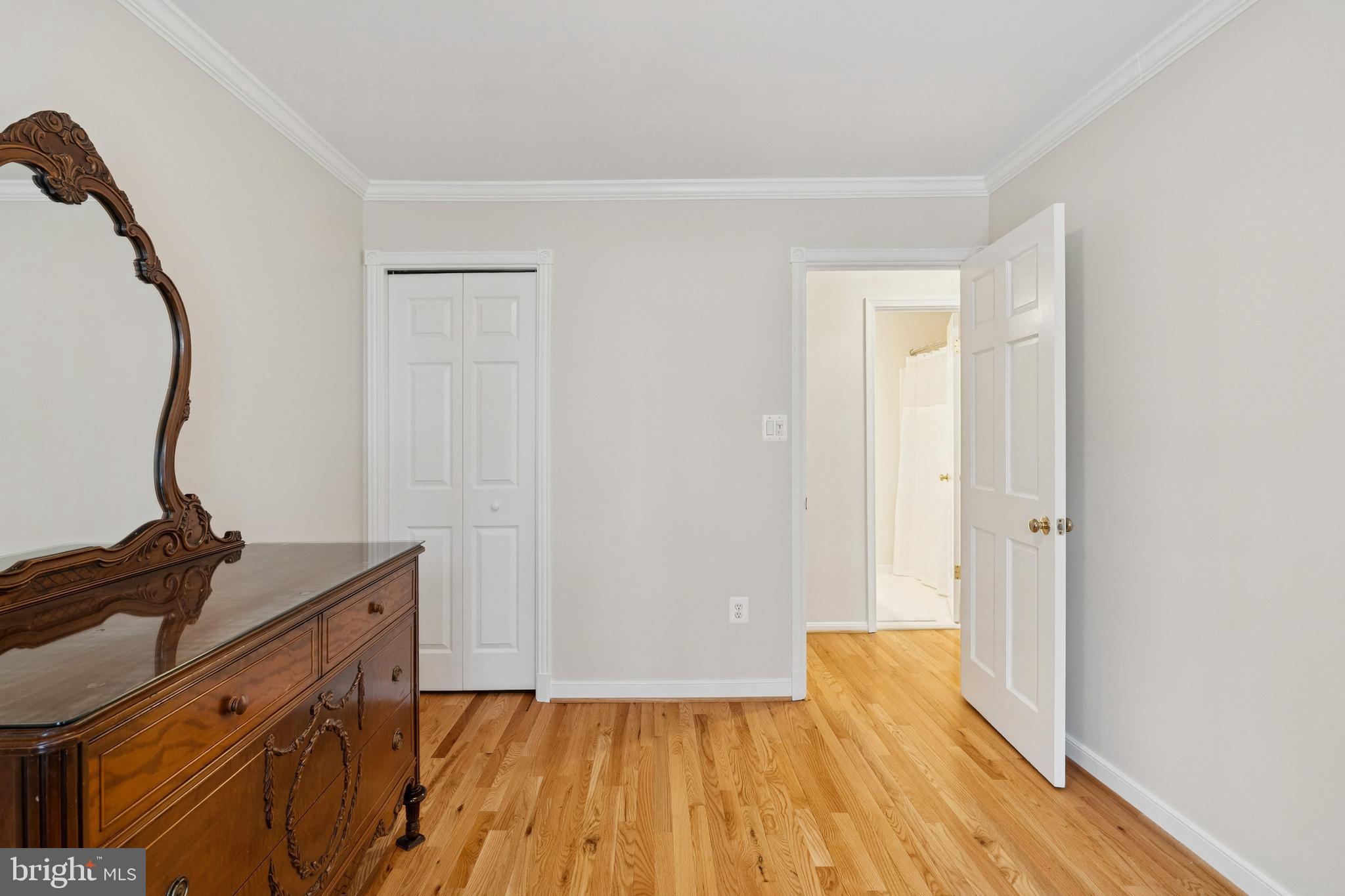 7810 Ashley Glen Road Annandale, VA 22003 - Photo 21 of 33 a view of a room with wooden floor and white walls