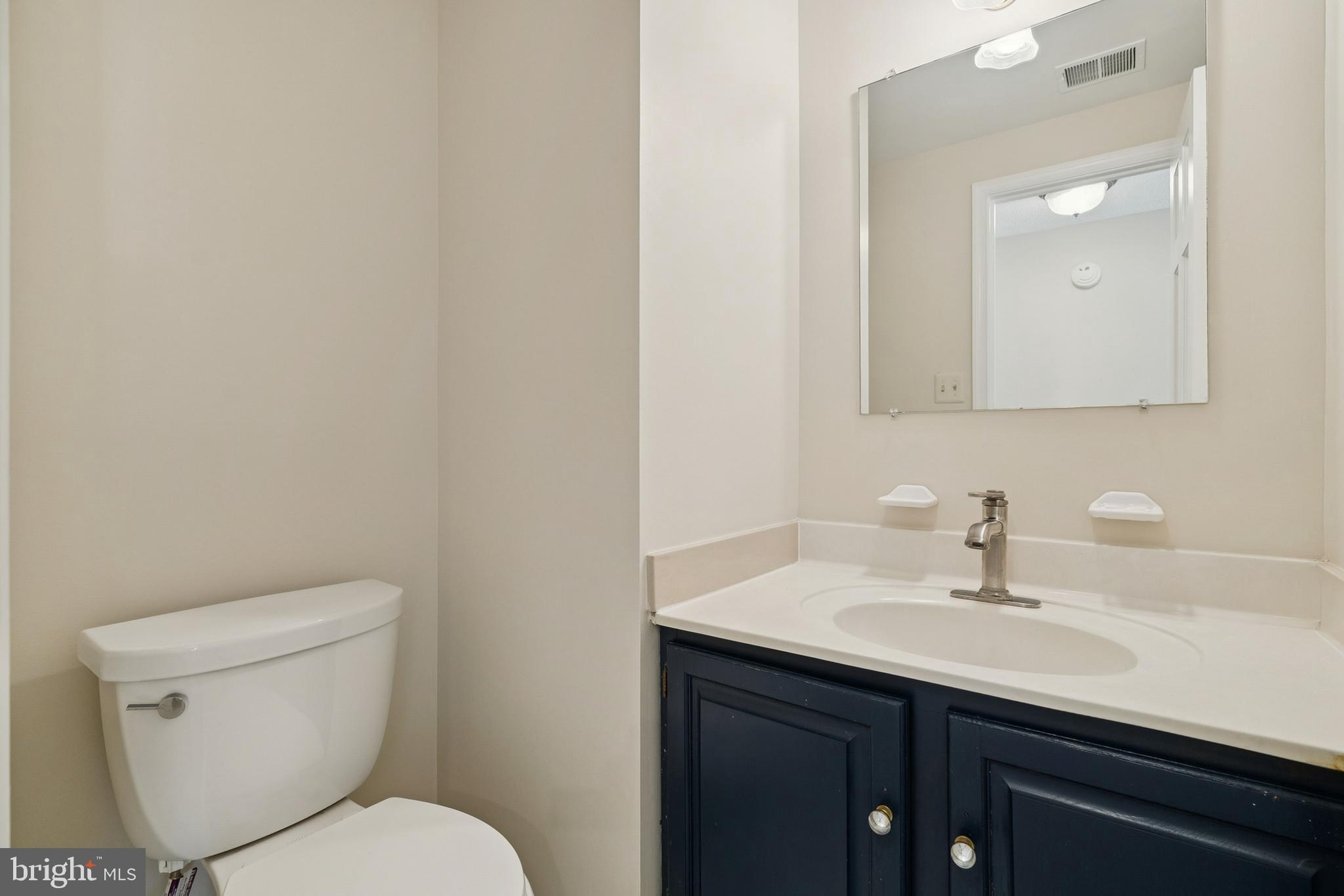 7810 Ashley Glen Road Annandale, VA 22003 - Photo 25 of 33 a bathroom with a sink a toilet and mirror