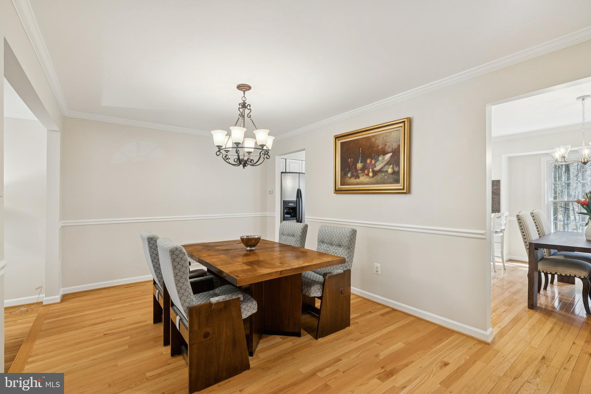 7810 Ashley Glen Road Annandale, VA 22003 - Photo 5 of 33 a view of a dining room with furniture and wooden floor