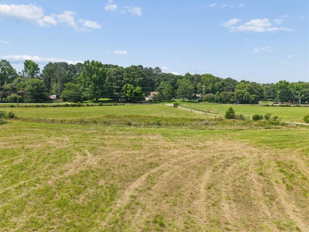 929 Nicholsville Road Monroe, GA 30656 - Photo 23 of 32 a view of a lake with houses in the back