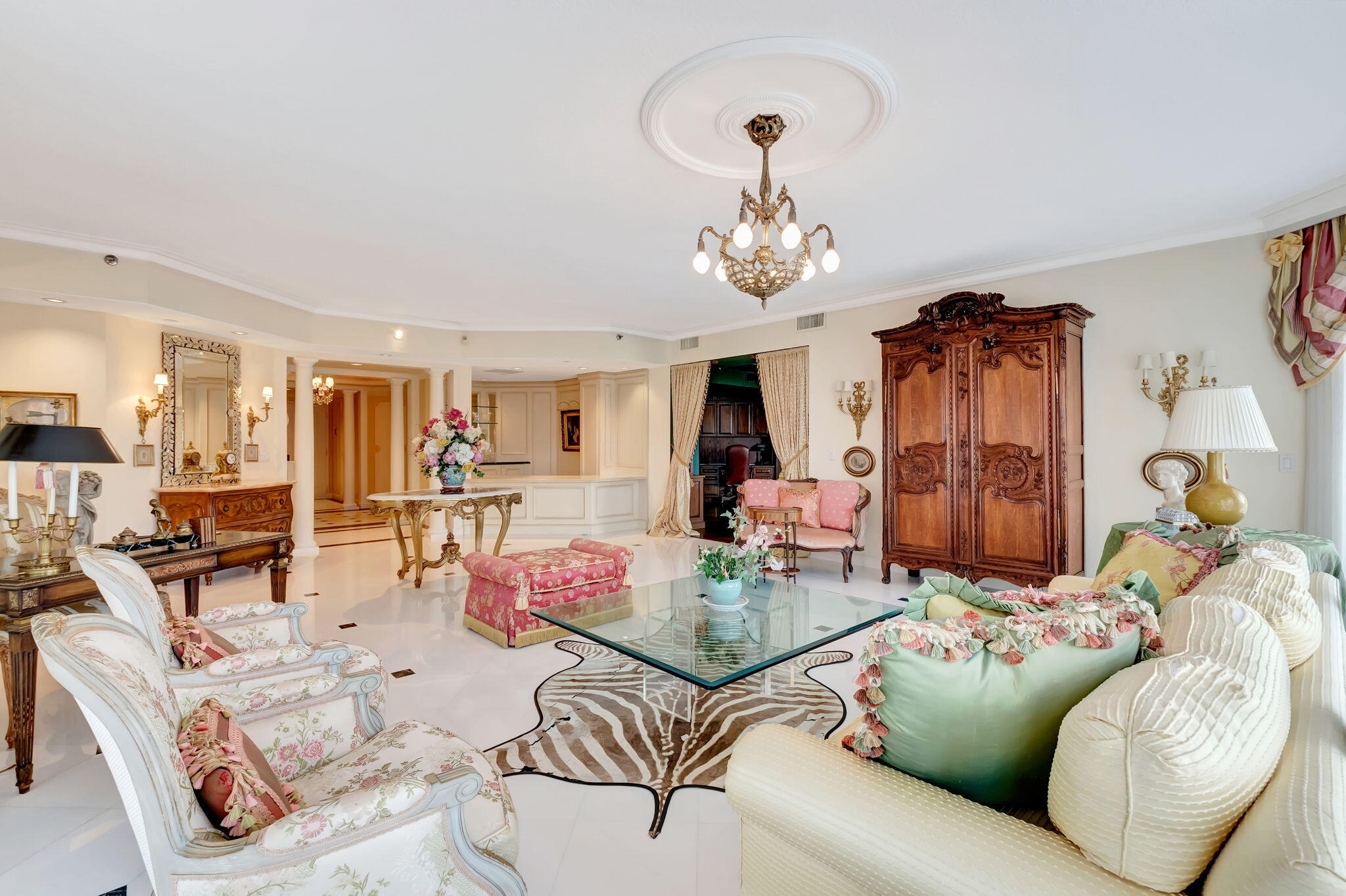 20290 Fairway Oaks Drive, Unit 254 Boca Raton, FL 33434 - Photo 20 of 104 a living room with furniture kitchen view and a chandelier