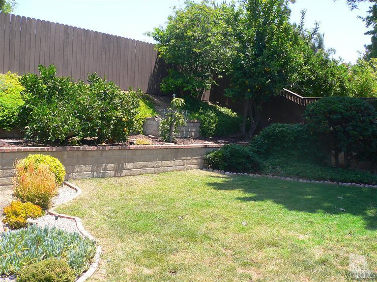 4340 Mill Valley Road Moorpark, CA 93021 - Photo 11 of 11 a view of a swimming pool with a bench and plants