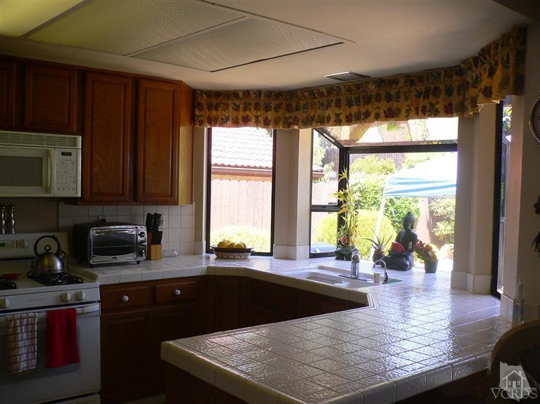 4340 Mill Valley Road Moorpark, CA 93021 - Photo 3 of 11 a kitchen with a large window in it and kitchen island