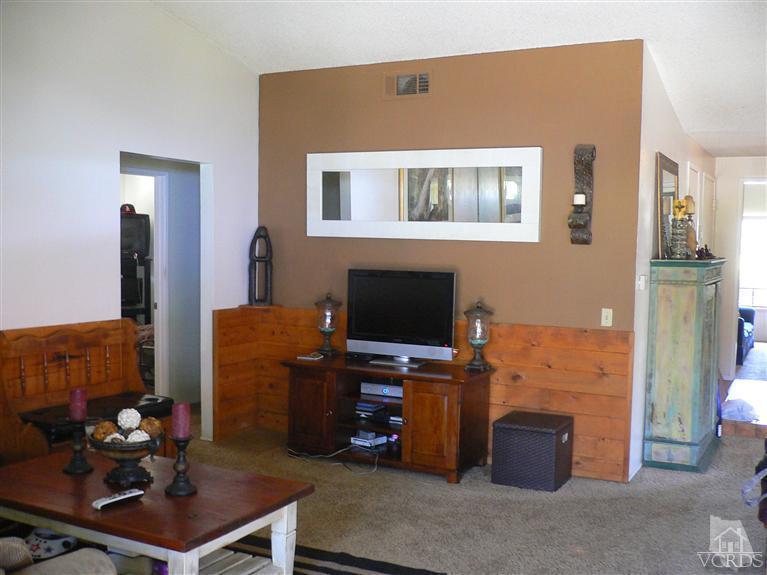 4340 Mill Valley Road Moorpark, CA 93021 - Photo 5 of 11 a living room with furniture a flat screen tv and a dining table