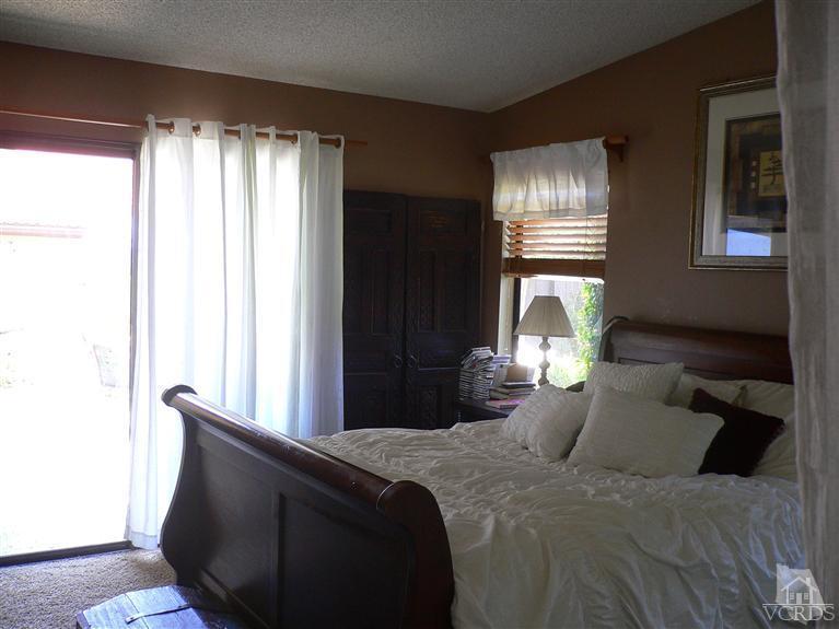 4340 Mill Valley Road Moorpark, CA 93021 - Photo 8 of 11 a bedroom with a bed and a window