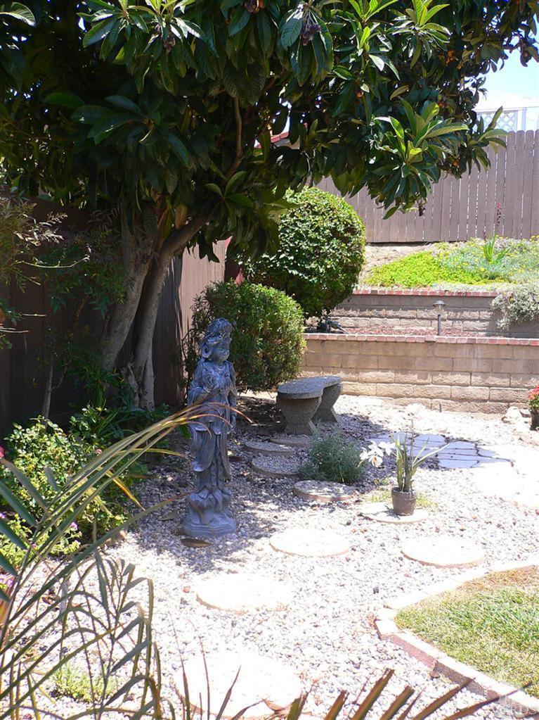 4340 Mill Valley Road Moorpark, CA 93021 - Photo 10 of 11 a view of a backyard with plants and a bench