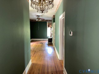 3533 Snakepath Road Blairs, VA 24527 - Photo 16 of 24 Hallway with wood-finish flooring, a crystal chand