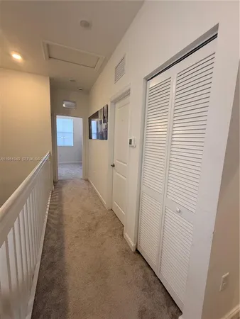 a bedroom with a bed and a cabinets
