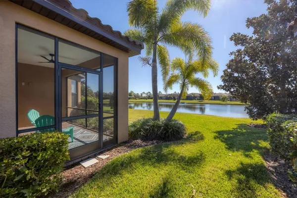 a view of a garden with a building in the background