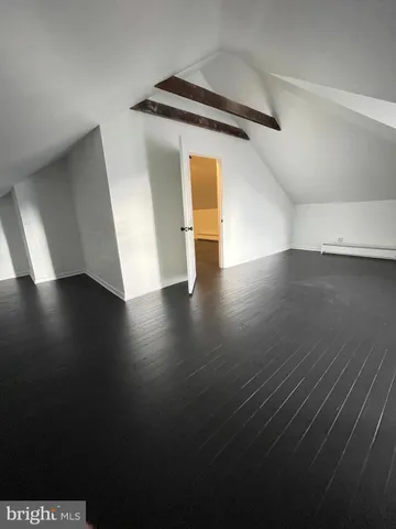 a view of a livingroom with wooden floor