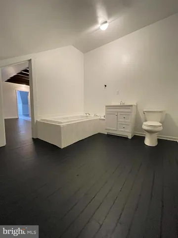 a view of a livingroom with wooden floor
